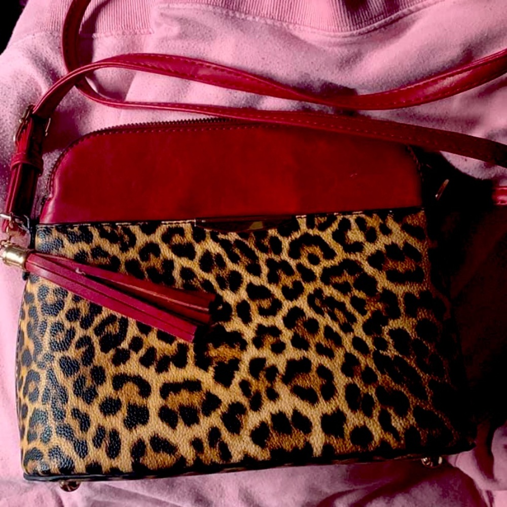 Red with leopard print purse made from Leather material